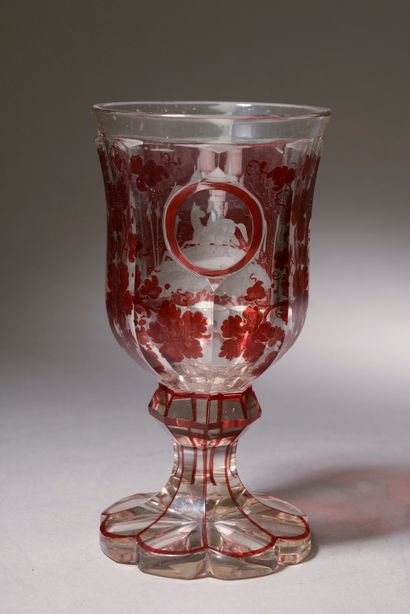  A Bohemian crystal stemmed glass with engraved horses on a ruby background (small...