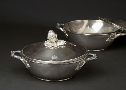 null Pair of silver vegetable dishes, the handles attached by vine leaves, the frétel...