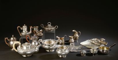 null Important silver lot including :

- Silver tea service with rich floral decoration,...