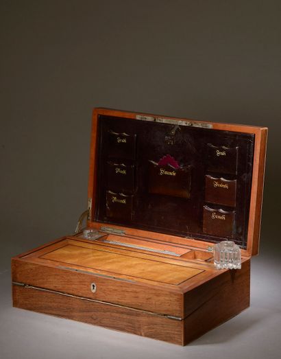  Writing case in rosewood veneer and light wood fillets, the lid applied with the...