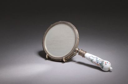  Small hand mirror, the silver frame decorated with ribboned rushes, the porcelain...