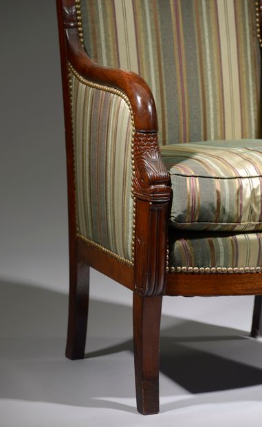 null Mahogany and mahogany veneer armchair, the back curved, the armrests ended by...
