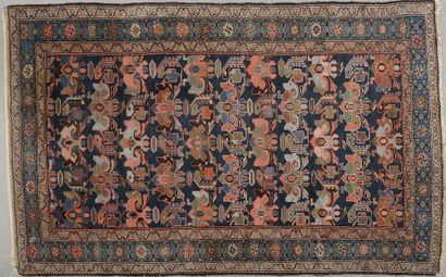 null Melayer wool carpet with polychrome tarantulas on a blue background.

Iran,...