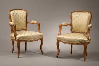 null Pair of armchairs in moulded natural wood, the back violoné, the armrests with...
