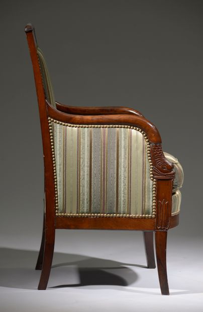null Mahogany and mahogany veneer armchair, the back curved, the armrests ended by...