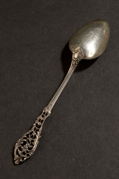 null Twelve small silver spoons, the spatula decorated with openwork floral scrolls.

Marked...