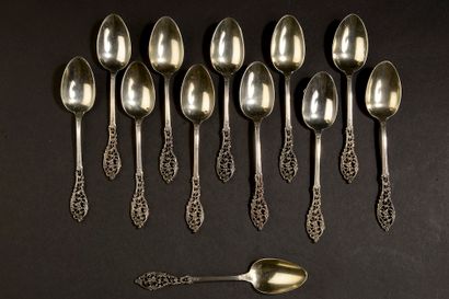Twelve small silver spoons, the spatula decorated...