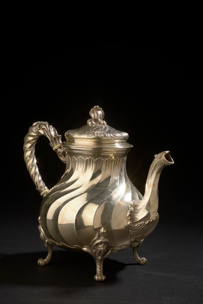 null Silver coffee pot with twisted ribs and rocaille resting on four arched feet.

Marked...