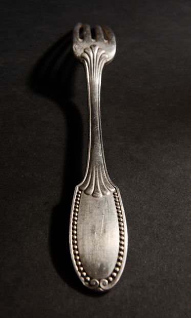 null Part of a silver household set with a rounded spatula bordered by a frieze of...