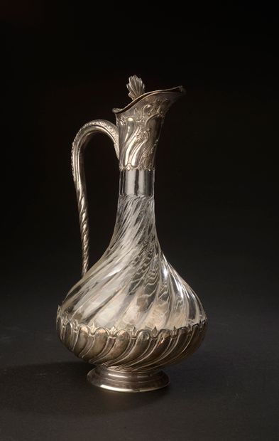 null Crystal ewer with twisted ribs, the silver mounting of rocaille style (a trace...