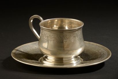 null *Lunch cup and its saucer in silver with engraved decoration of a leafy frieze.

About...