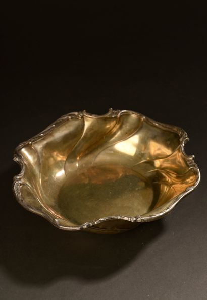 Round-bottomed silver bowl, the edge scalloped,...