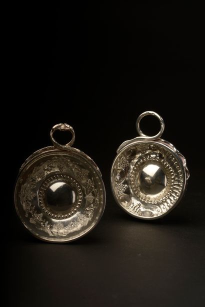 null Set of two silver tastevins including :

- Tastevin with interior decoration...