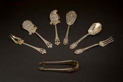 null Silver candy set partially gilded, the stems ending with a fleur-de-lys, the...