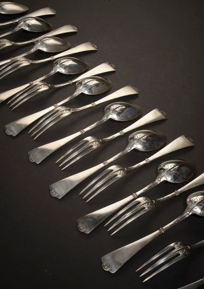 Eleven large spoons and ten large forks in...