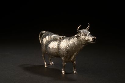 Cow forming an engraved silver cup, the back...