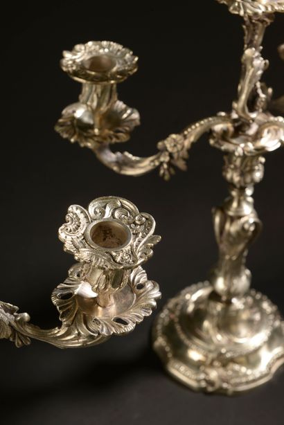 null Pair of silver plated candelabras decorated with interlacing foliage and flowers,...