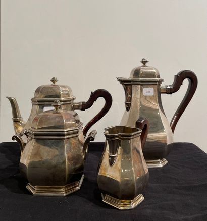 null Silver tea and coffee set with cut sides and wooden handles. It includes a teapot,...