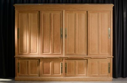 null Important moulded oak furniture, the front opening with four sliding doors in...