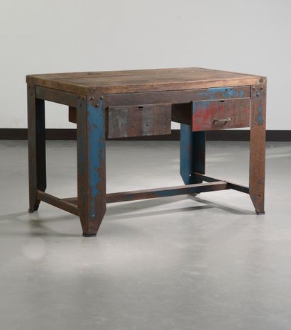 null Old industrial workbench forming a table, the top made of solid wood planks....
