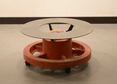 Small circular table on wheels, the wooden...