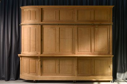 A large moulded oak corner cabinet opening...