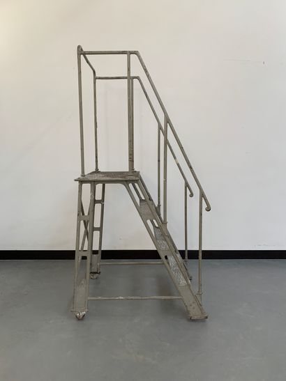 null Metal staircase with tubular structure with three steps and a top. The whole...