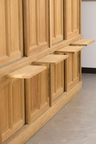 null Important moulded oak furniture, the front opening with four sliding doors in...