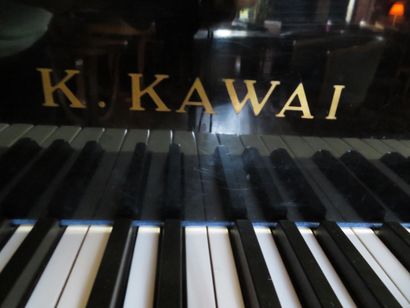 null 
K.KAWAI model KG 2C Black lacquered wood quarter grand piano on castors With...
