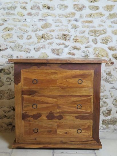 Natural wood chest of drawers opening by...