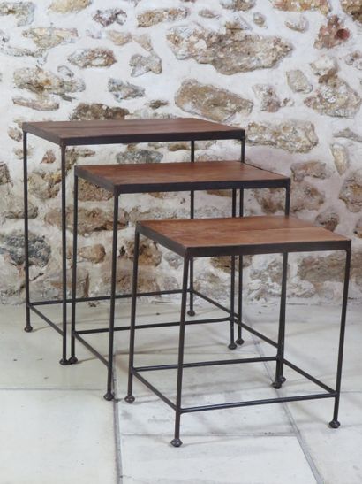 Set of three nesting tables, the top in wood,...