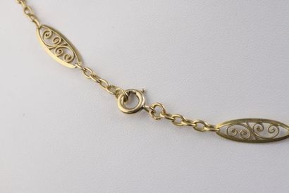 null Necklace in 18k yellow gold with twelve oval filigree links alternating with...