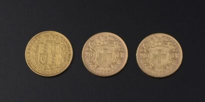 null Ensemble de trois pièces d'or comprenant :

- Deux 20 francs suisses;

- Souverain...
