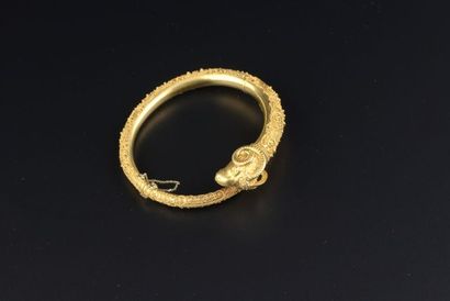 null Bracelet 18k yellow gold ram head design, the body applied with a filigree and...