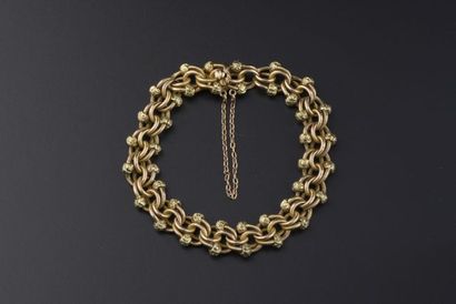 null 18k rose gold double twisted link bracelet, adorned with two hammered yellow...