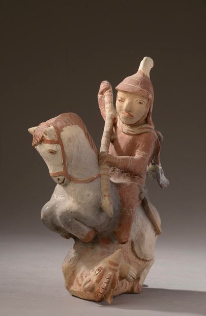 null Dans le goût de la Chine - XXe siècle.

Statuette polychrome en terre cuite...