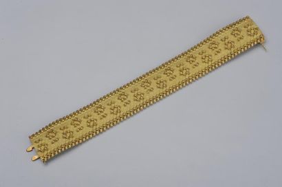 null Bracelet large et articulé en or jaune tressé, orné de motifs noeuds / Long....