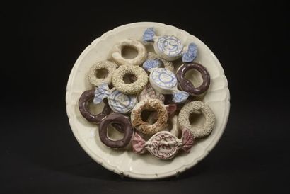 null Mural in earthenware representing a plate filled with sweets (chip under the...