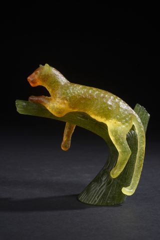 null DAUM.

Subject representing a panther in glass paste, of orange color shaded...