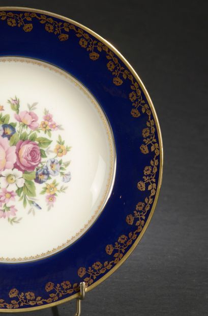 null LIMOGES.

Part of a porcelain dinner service with polychrome enamelled decoration...