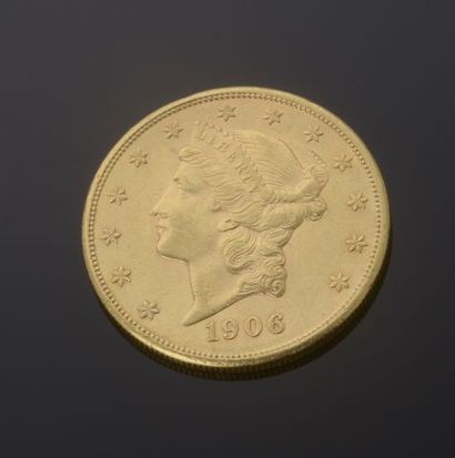 null 
Pièce en or de 20 Dollars américains au profil de la Liberté datant de 1906.




Diam....