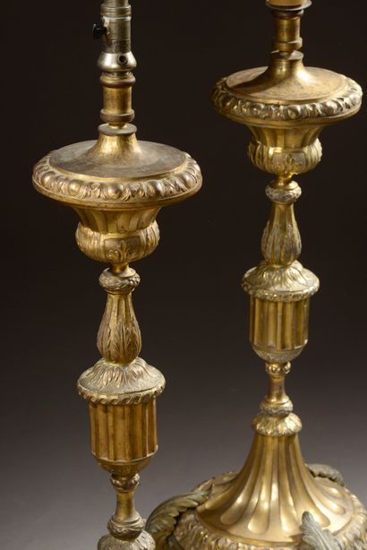 null Pair of important gilded and embossed copper pikes resting on three bronze acanthus...