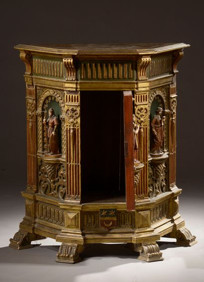 null Trapezoidal piece of furniture in carved and gilded wood, the three faces with...