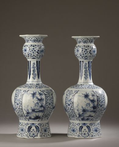 null Pair of Delft earthenware bottle vases with globular neck and body decorated...