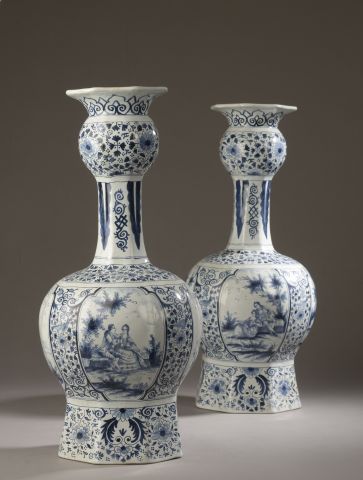 null Pair of Delft earthenware bottle vases with globular neck and body decorated...