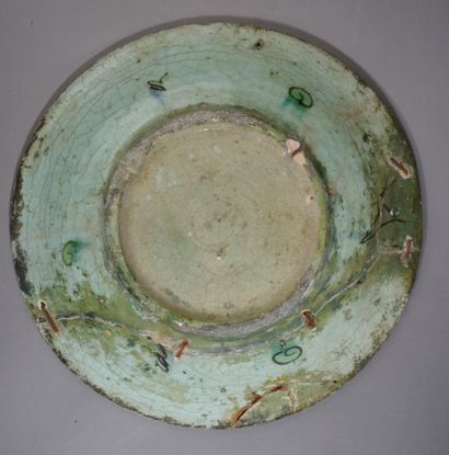 null 
Siliceous ceramic dish with blue, green and brown decoration of a central medallion...