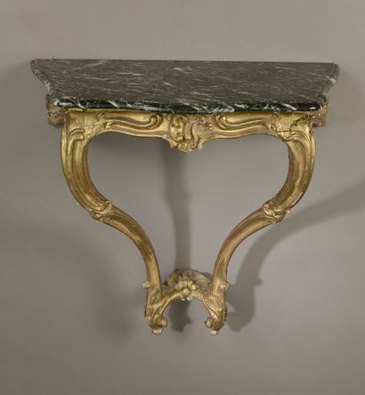 null Small console in molded, carved, stuccoed and gilded wood decorated with foliage...