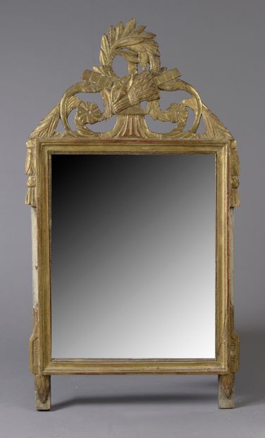 Wooden mirror and gilded composition, the...