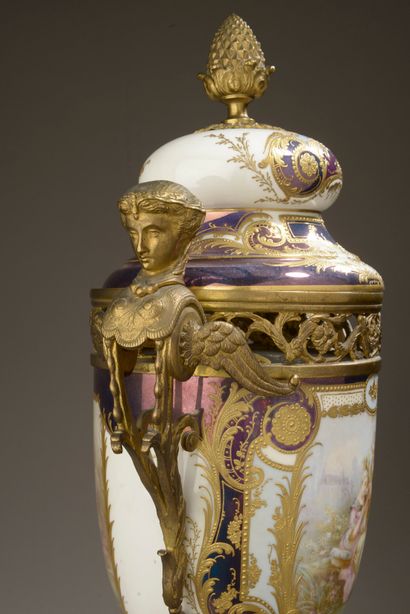 null Porcelain potpourri vase with pedestal and swollen lid richly painted with a...