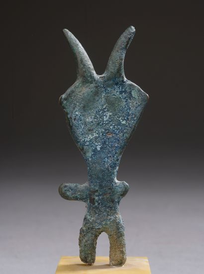 null 
Small bronze statuette representing a horned Piravend idol (restorations)....